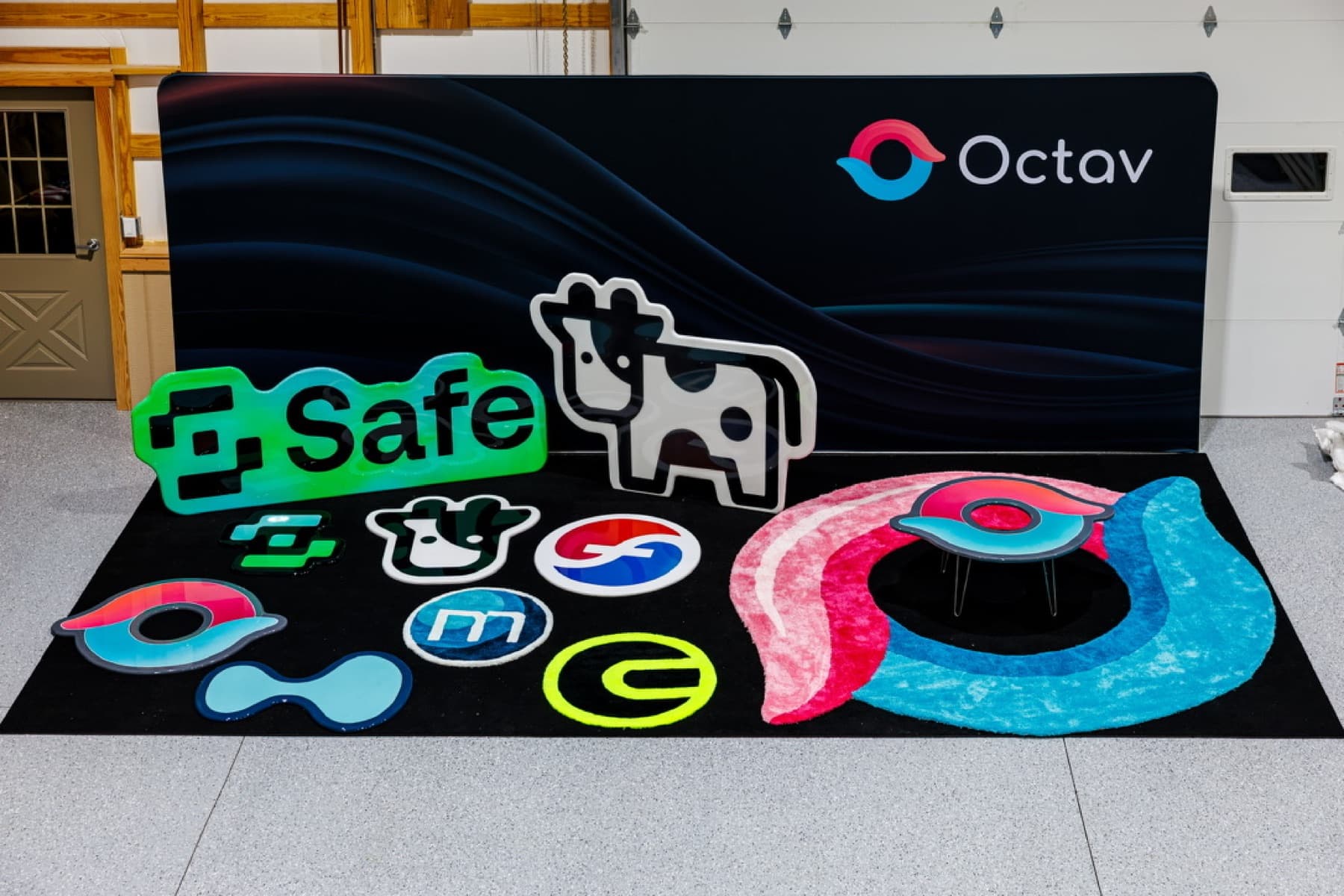 Booth pieces and gloss signs laid out in the Atlas shop